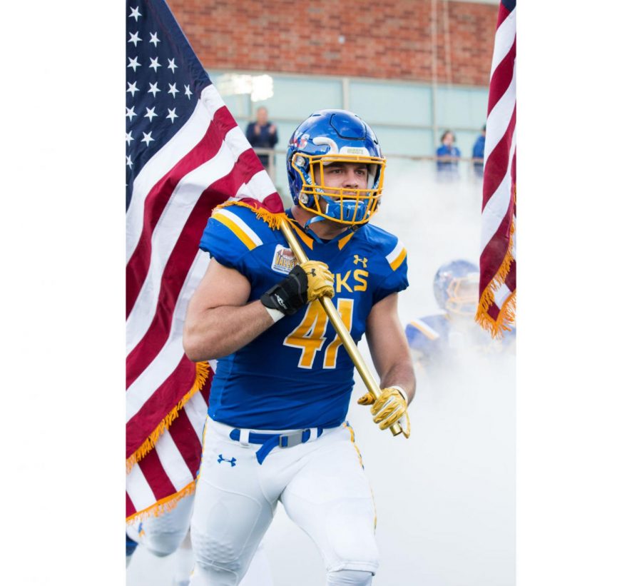 At the annual Military Appreciation game on Oct. 1, 75 American flags, each military branch’s flag and the POW/MIA flag were flown along the top of the east side of the Dana J. Dykhouse stadium. Kane Louscher was one of several players to carry American flags onto the field.