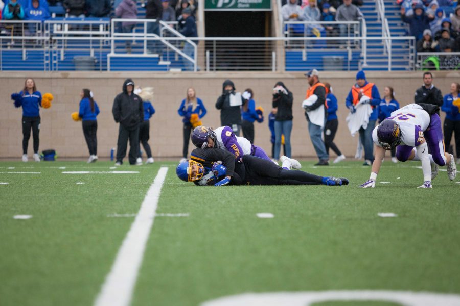 THIEN NGUYEN 
Jake Wieneke is brought down after catching a 19-yard pass for a first down Oct. 14 during the Hobo Day game. The Jacks fell to the Panthers 38-18.