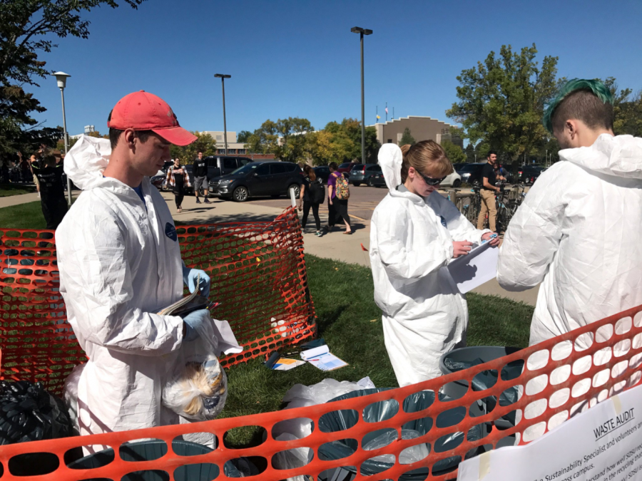 MAKENZIE HUBER
Sustainability Specialist Jennifer McLaughlin, Sustainability Council President Kory Heier and Dylan Lewark, freshman computer science major, sort trash for a waste audit in front of The Union Sept. 20.