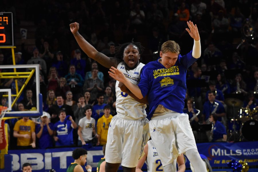 ABBY FULLENKAMP
Freshman guard David Jenkins Jr. (5) and sophomore guard Beau Brown (15) celebrate Jenkins layup before a media timeout during the second half of the game against NDSU Feb. 1. The Jacks beat the Bison 82-63. They host Western Illinois at 2pm Saturday, Feb. 17 in Frost Arena.