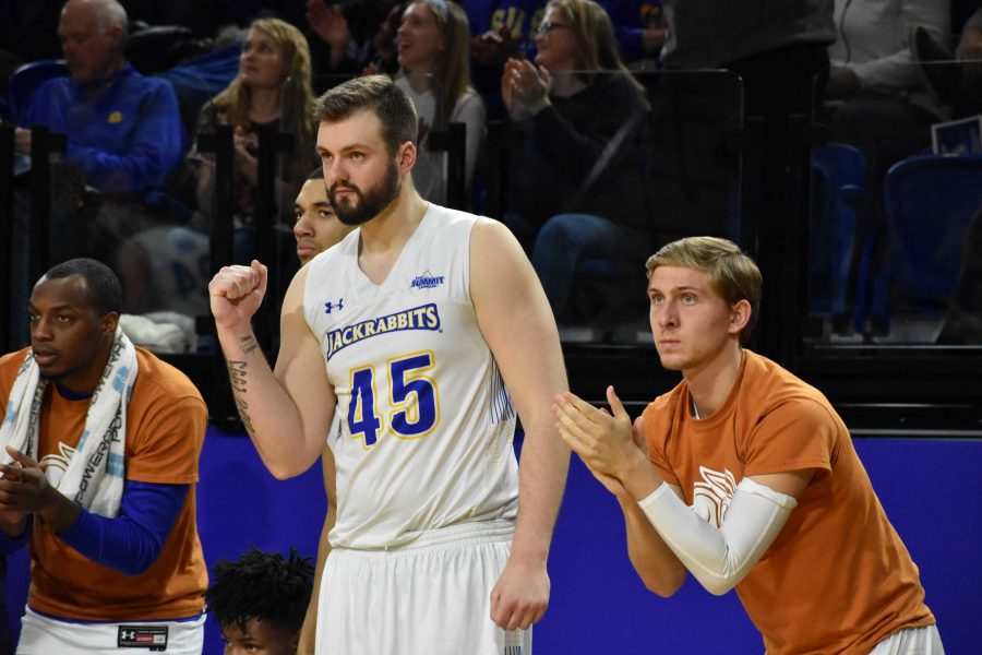 ABBY FULLENKAMP
Senior forward Ian Theisen (45) and sophomore guard Beau Brown (15) cheer on their teammates during the second half of the game against USD Feb. 22. The Jacks won 76-72. The men are the first seed for the Summit League Tournament.