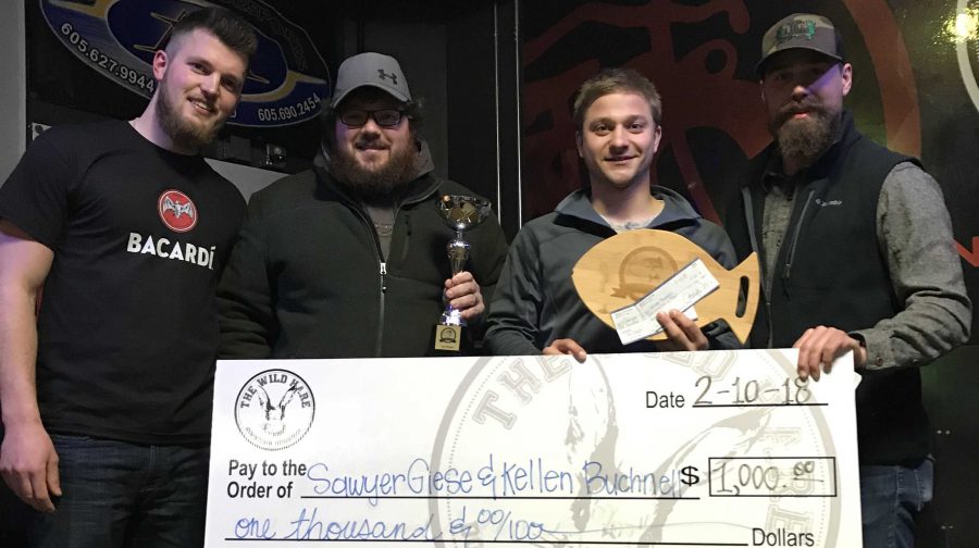 SUBMITTED
(Left) Jorgen Dahl, Kellen Bucknell, Sawyer Giese, and Hayden Hoeschler hold the check and first place trophy for The Wild Hare/HD Outfitters Ice Fishing Tournament Feb. 10.  Dahl and Hoeschler are co-owners of HD Outfitters and presented the check to Bucknell and Giese for placing first in the tournament. There were more than 50 participants at the tournament.