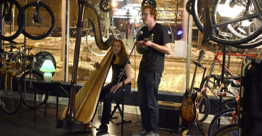 ABBY FULLENKAMP
Tuthill Balloon Club’s Mark and Ann McLaughlin perform one of Mark’s original songs at their March 24 performance in the Blustem bike shop, downtown Brookings. The brother-sister duo started performing different shows together a few years ago. 