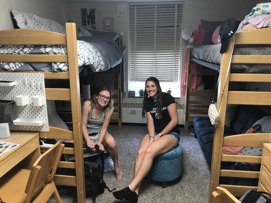 Molly Lange and her roommate Hanna Siemonsma sit in their room in Young Hall. 