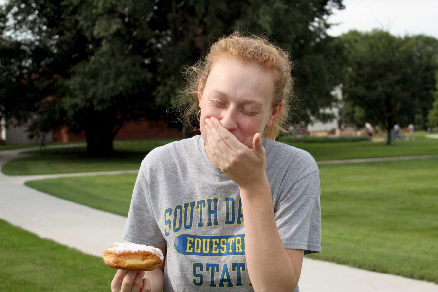 JENNY NGUYEN Sophomore Jillian Justesen enjoys one of the many donuts by Flyboy Donuts, which are sold every Thursday in The Union Coffee, Java City or at the Larson and Hansen C-stores.