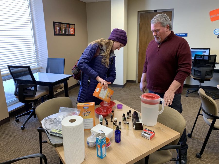 Kristina Rice, junior family and consumer sciences education major, participates in making a bath bomb during TRIO National Relaxation Day event with help from TRIO Program Director, Jeff Vostad