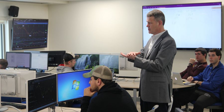 South Dakota State University Professor Matthew Diersen speaks to the agricultural futures and options class in Harding Hall. Thanks to the POET Commodity Trading Fund, the class’s 18 students get a real-world, hands-on trading experience.