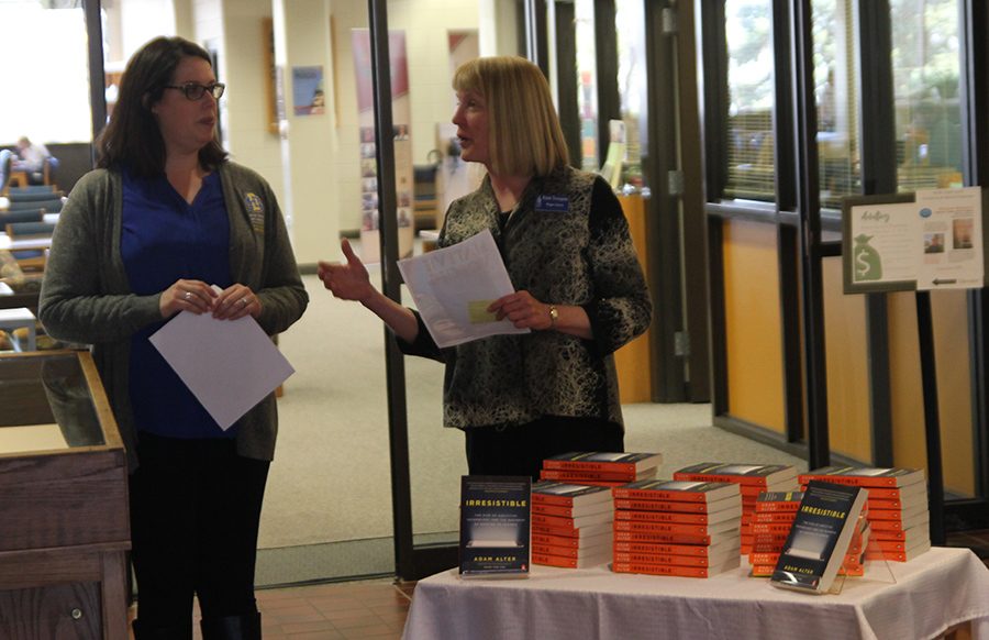 From left, Rebecca Bott-Knutson, dean of South Dakota State University’s Van D. and Barbara B. Fishback Honors College, and Chief University Librarian Kristi Tornquist discuss the 2019 Common Read selection Tuesday afternoon at the Hilton M. Briggs Library.