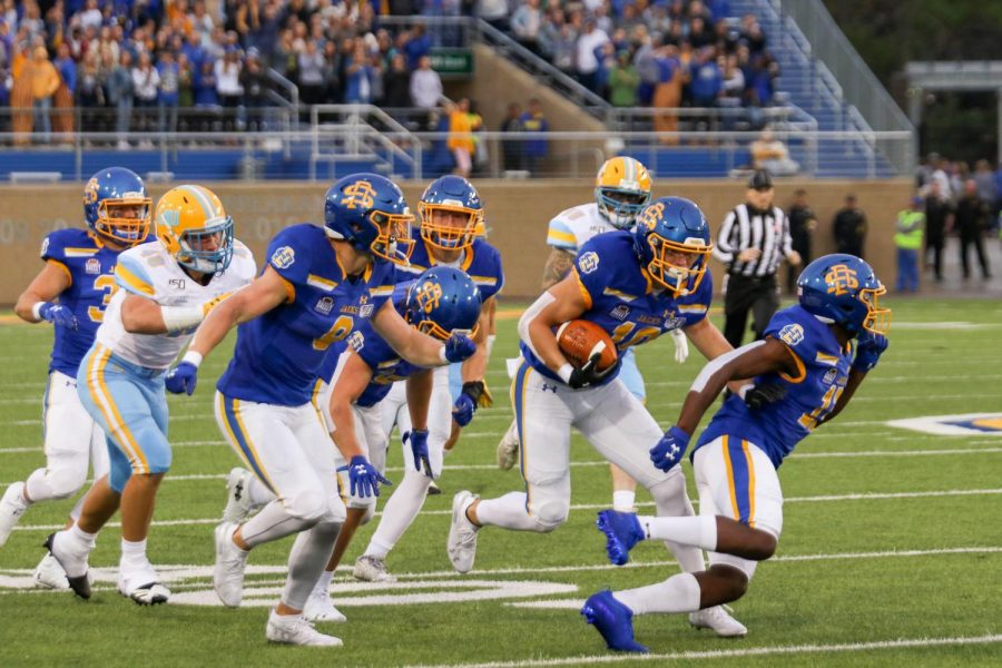 South Dakota State redshirt freshman and Madison, South Dakota, native Jaxon Janke (10, with football) runs through would-be tacklers with the help of several escorts, including twin brother Jadon (9), on a 77-yard punt return touchdown Sept. 7 against Long Island. After appearing in just seven combined games in 2018, Jadon and Jaxon, who play wide receiver, are seeing regular playing time in 2019.
