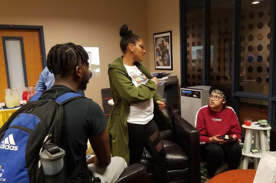 From left, Adonai Ghebrekidan, Akeah Aschmeller and Alea Cailles get acquainted at the Office of Multicultural Affairs Welcome Back Reception on Aug. 29.