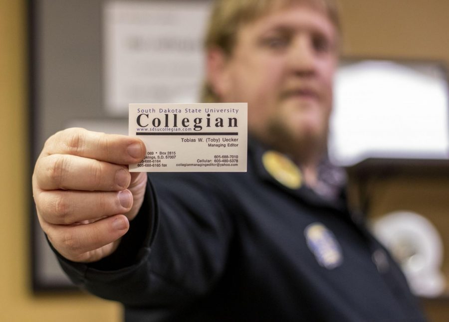 Toby Uecker still has his business card from his time as the Managing Editor at The Collegian.