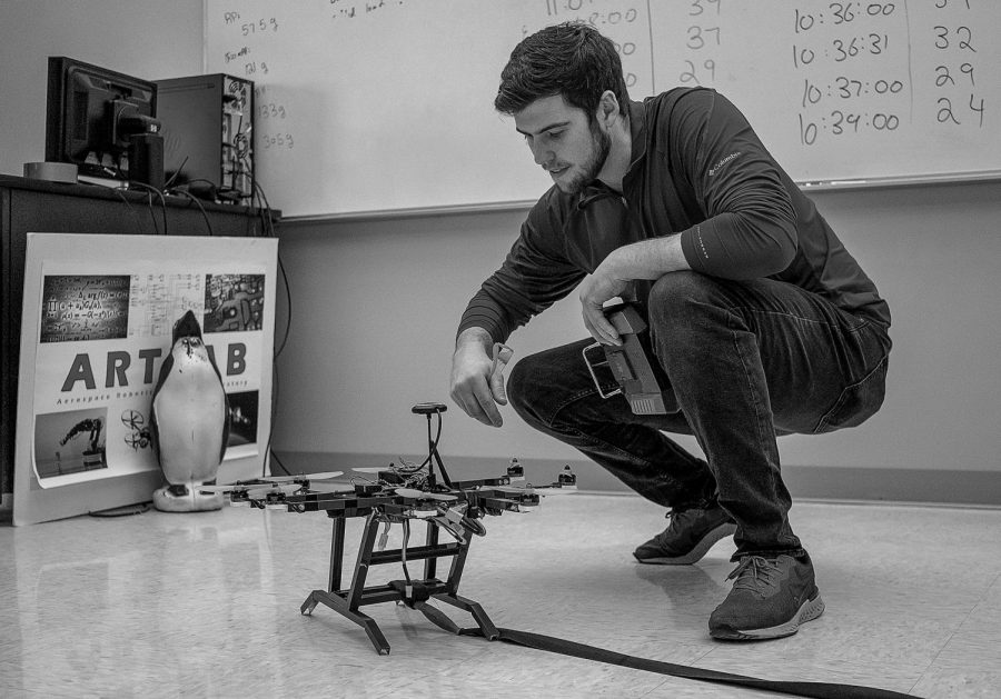 Engineering student Nick Runge works on drone for the design project at South Dakota State University. 