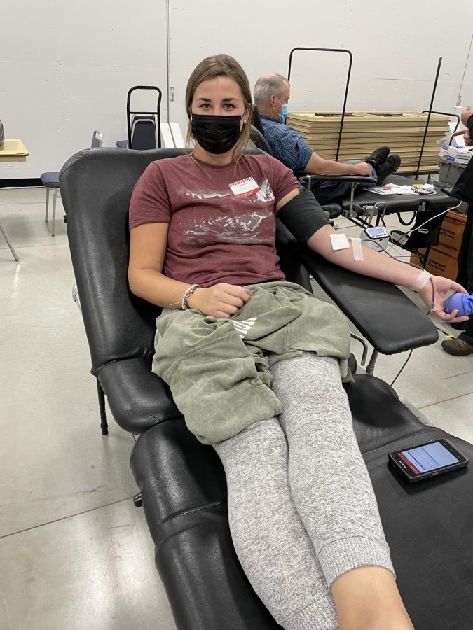 Leah Irlbeck, a sophomore early childhood education major from Redwood Falls, Minnesota, gives blood at a recent blood drive in Brookings.