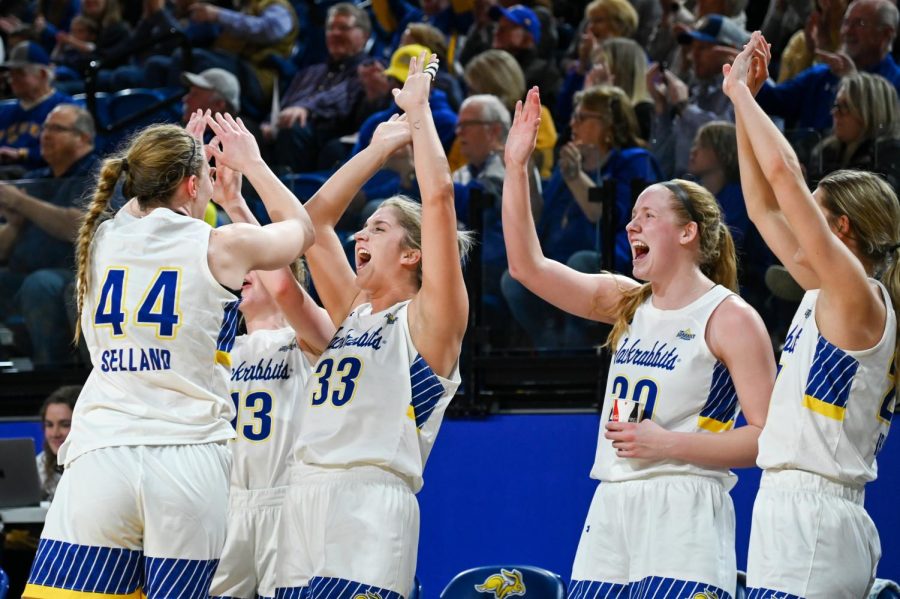 The Jackrabbits cheer after a hard-fought victory over Alabama Sunday night in the quarterfinal round of the WNIT. The Jacks won in front of 4,268 fans at Frost Arena. This crowd was the largest for a women's game in six years.