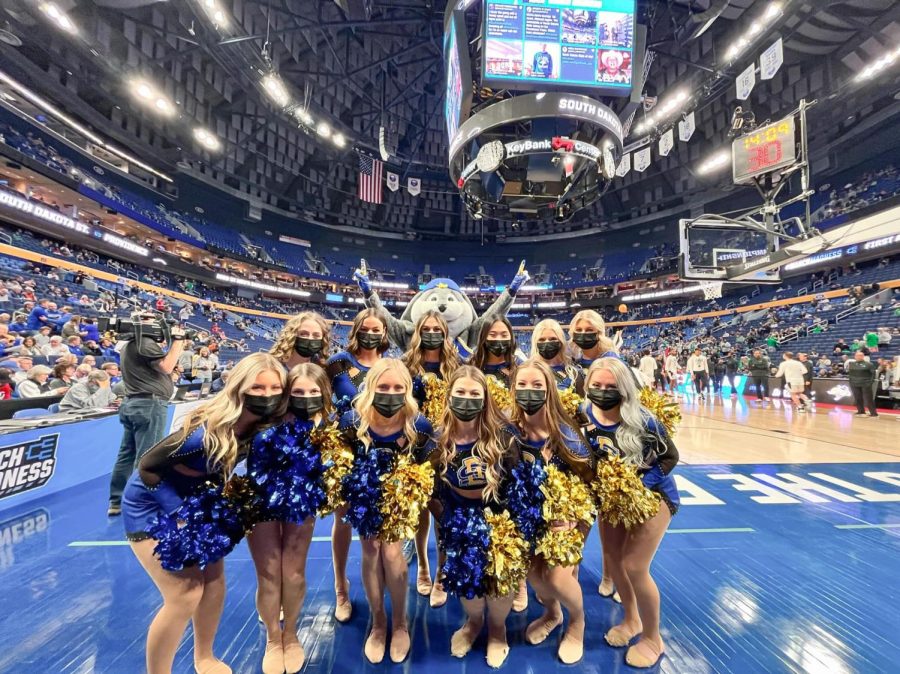 The+SDSU+Dance+Team+poses+with+Jack%2C+the+Jackrabbit%2C+at+the+men%E2%80%99s+NCAA+Tournament+in+Buffalo%2C+New+York.+The+dance+team+will+be+competing+at+the+National+Dance+Association+College+Nationals+in+Daytona+Beach%2C+Florida%2C+April+6-10.%0A