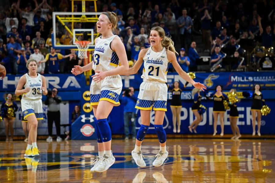 Haleigh Timmer (13) and Tylee Irwin (21) celebrate after a play in the Jacks wire-to-wire 82-50 victory over Seton Hall in the WNIT championship game. 