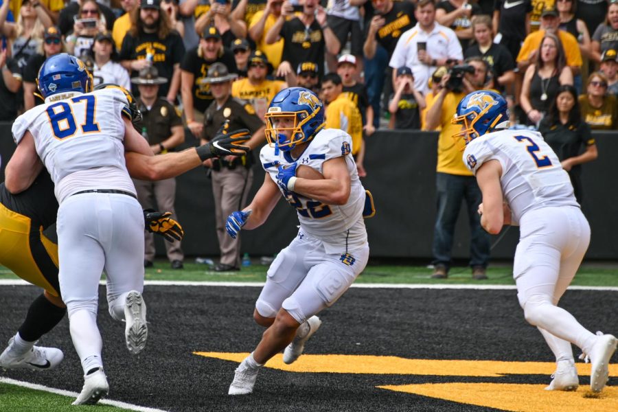 South Dakota State running back Isaiah Davis carries the ball in a NCAA football game against the Iowa Hawkeyes at Kinnick Stadium. The Jackrabbits fell to the Hawkeyes 7-3 in an game that included more combined punts (21) than first downs (16).