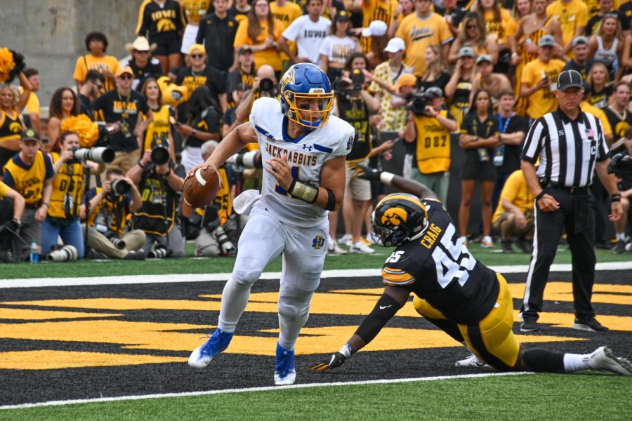 South Dakota State quarterback Mark Gronowski running with the ball in a football game against the Iowa Hawkeyes Saturday, Sept. 3. Prior to this season, Gronowski had not played a game since he suffered a torn ACL in the Football Championship Subdivision Championship Game May 8, 2021. Now, nearly 500 days later, Gronowski is back on the field.