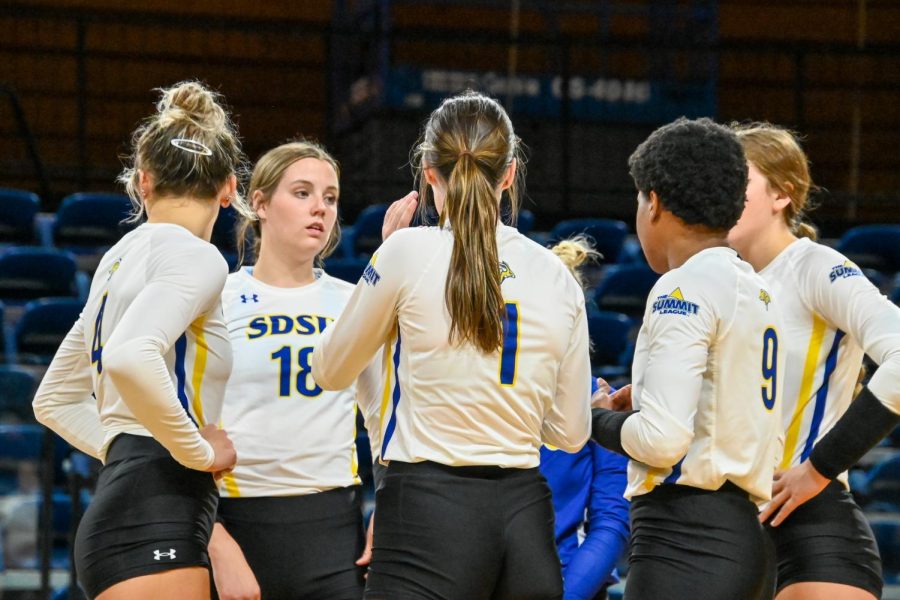 The SDSU volleyball team huddles together during a Summit League volleyball game earlier this season.