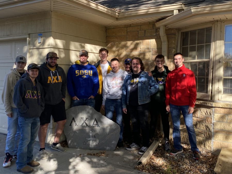 Members of the SDSU and USD Lamda Chi Alpha fraternities participate in the yearly football relay from Vermillion to Brookings.