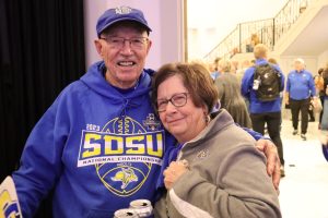 Keith Jensen with his wife Cherie at the SDSU alumni pep rally Jan. 7 at Frisco Hall.