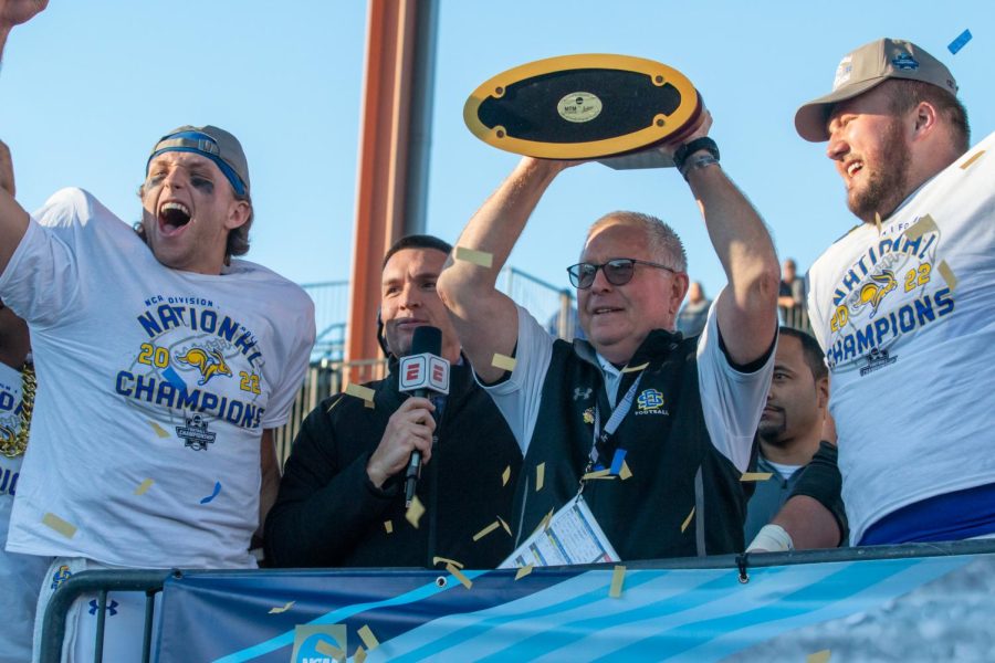 Jacks coach John Stiegelmeier hoists the national championship trophy after SDSUs 45-21 win against NDSU in the FCS national title game. It would prove to be Stiegelmeiers final game as head coach of the Jackrabbits.