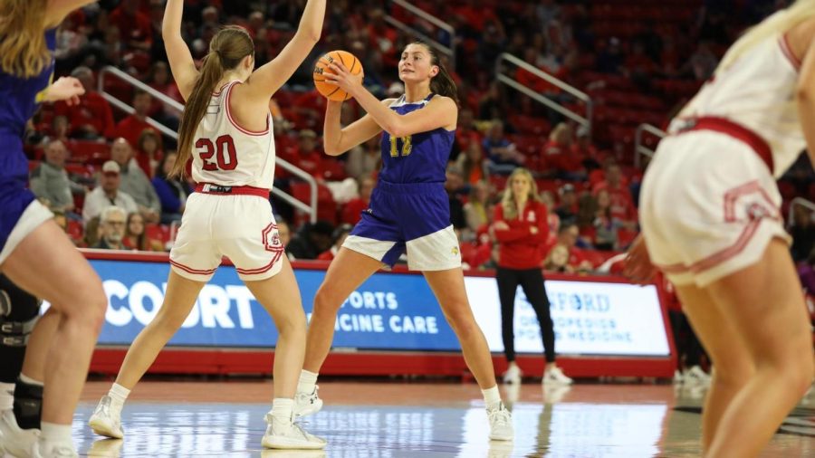 South+Dakota+State%E2%80%99s+Kallie+Theisen+looks+to+pass+the+ball+on+USD%E2%80%99s+Carley+Duffney+in+a+Summit+League+basketbal+game+Feb.+11+against+the+Coyotes.+The+Jacks+beat+USD+by+31+points+in+that+game+to+clinch+sole+possession+of+the+regular-season+conference+title.