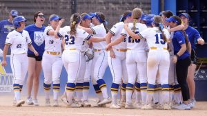 The South Dakota State softball team gathers around to celebrate at a game on Friday, May 5 in Brookings.