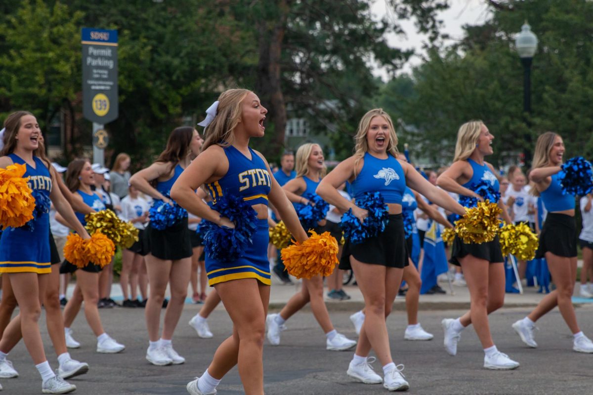 The Cheer and Dance Team celebrate at the One Day for STATE block party Sept. 7. 