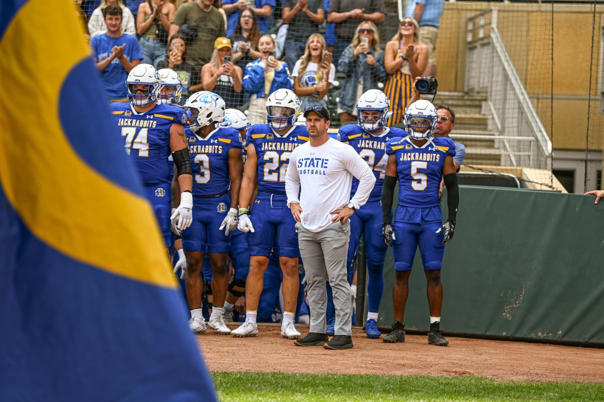 Head Coach Jimmy Rogers and the Jackrabbit Football team look out at Target Field before their game against Drake in Minneapolis, Minn. Saturday, Sept. 16.