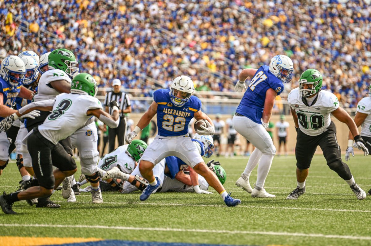 Isaiah Davis jukes out defenders in the SDSU win against UND.