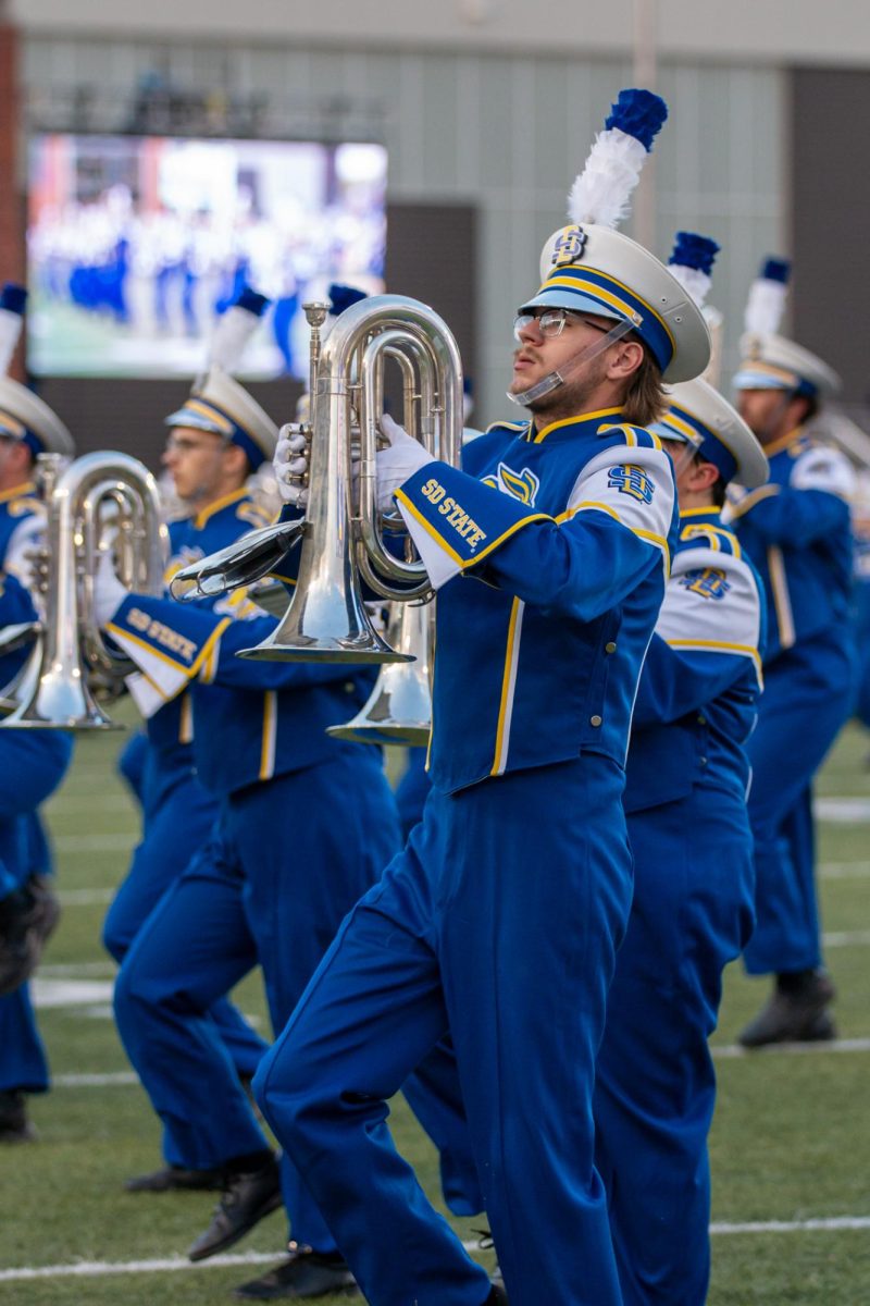 The Pride of the Dakotas Marching Band performs during an SDSU football game this season. The band has been targeted by some students in the student section who have been throwing empty alcohol bottles at them. 
