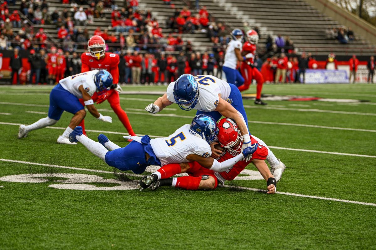 Adam Bock and DyShawn Gales make a tackle in the Jacks’ 34-0 win over Youngstown State Saturday at Stambaugh  Stadium. Bock led the team in tackles with 7 and Gales had 4.  