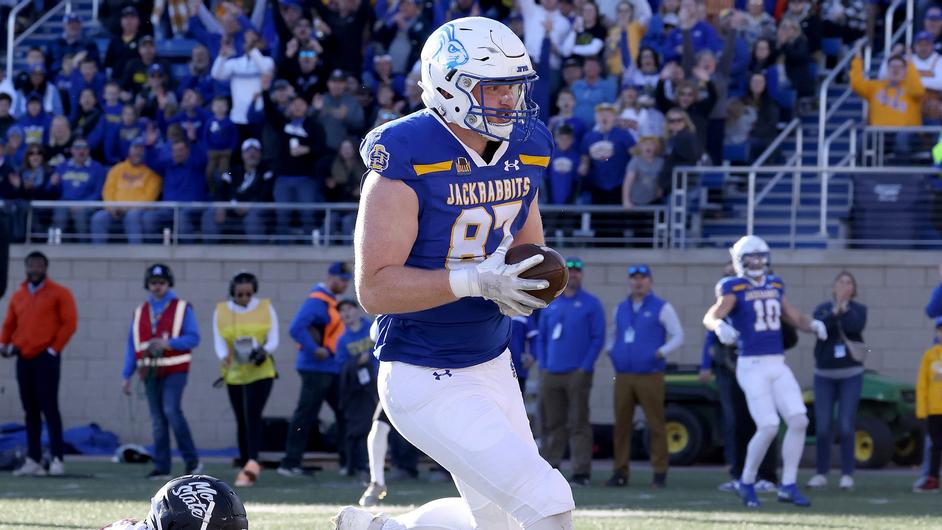 BROOKINGS, SD: NOVEMBER 18: Zach Heins #87 of the South Dakota State Jackrabbits crosses the goal line for a touchdown against the Missouri State Bears during their game at Dana J. Deckhouse Stadium in Brookings, SD. 