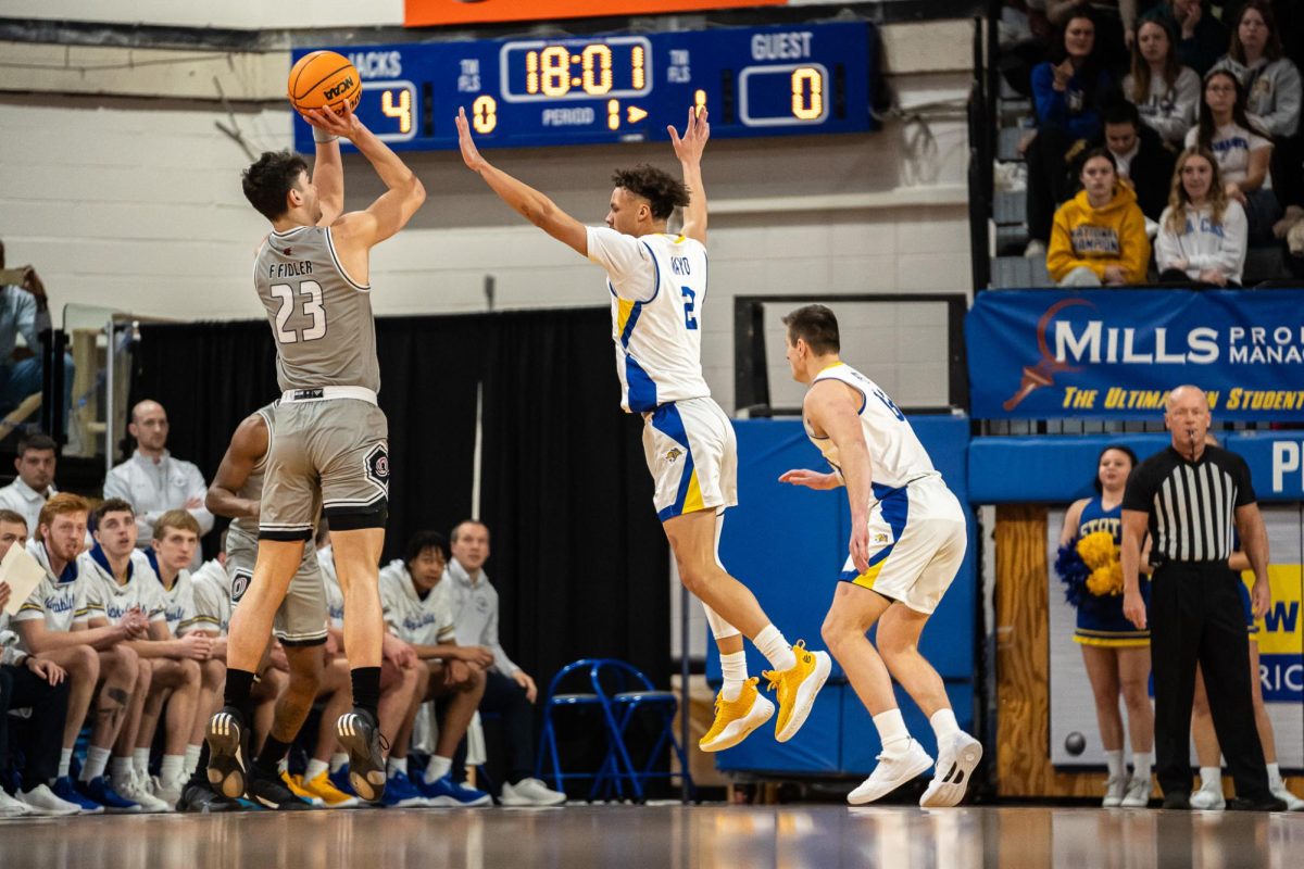 Zeke Mayo defends Omaha shooter as he pulls up from three. This season, the junior guard is averaging 18.5 points, 6.1 rebounds, 3.5 assists and 1.3 steals per game while shooting 47.7% on field goals and 39% from the arc. 
