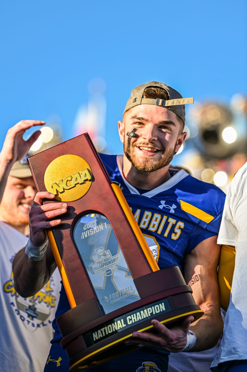 South Dakota State’s Jaxon Janke holds the National Championship trophy after the team beat Montana 23-3 in the championship game in Frisco, TX Sunday, Jan. 7, 2024.