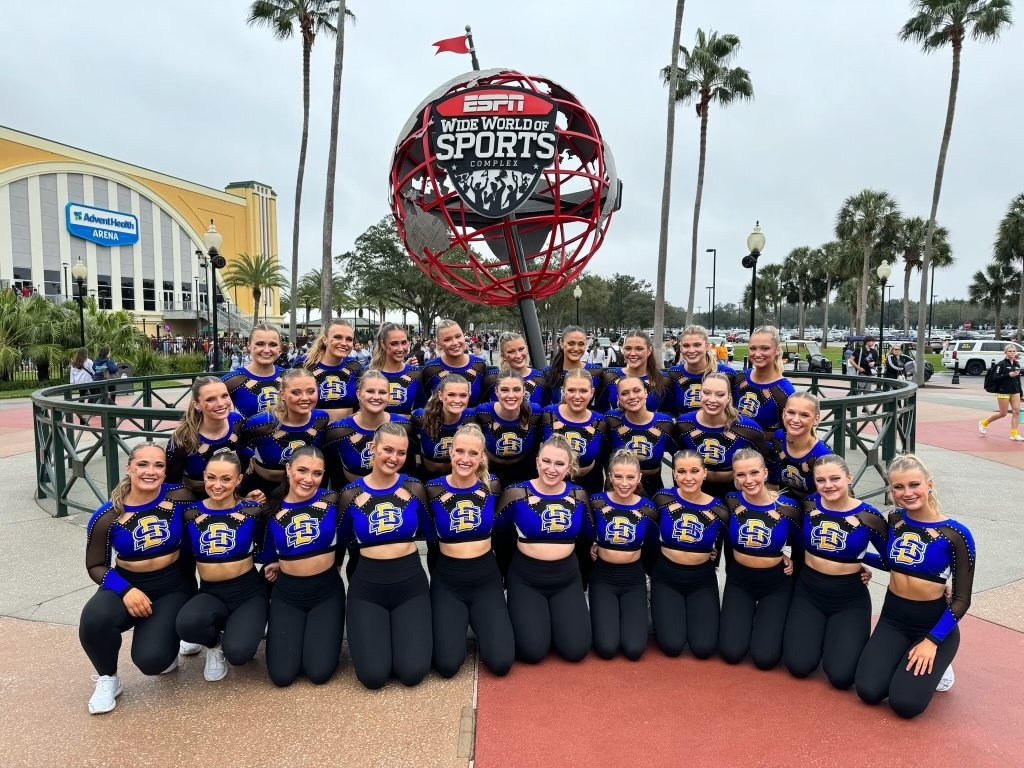The SDSU Dance Team poses for a group photo at the ESPN Wide World of Sports complex in Orlando, Florida. The team runs concessions at various sporting events and cleans up after converts or basketball games to make as much as possible for nationals.