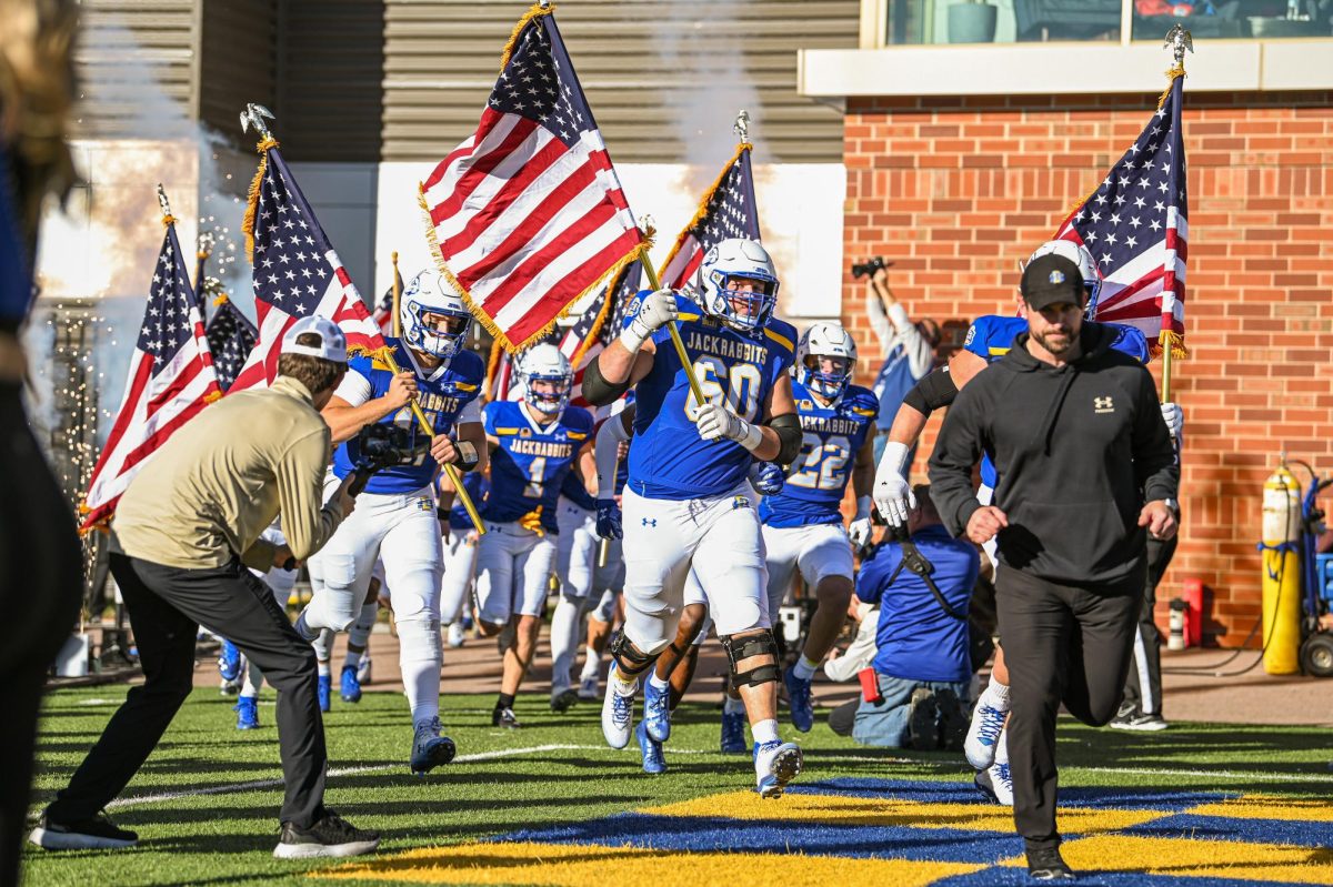South Dakota State head coach Jimmy Rogers leads his team out of the locker room before a football game against Missouri State at Dana J. Dykhouse Stadium in Brookings on Saturday, Nov. 18, 2023.