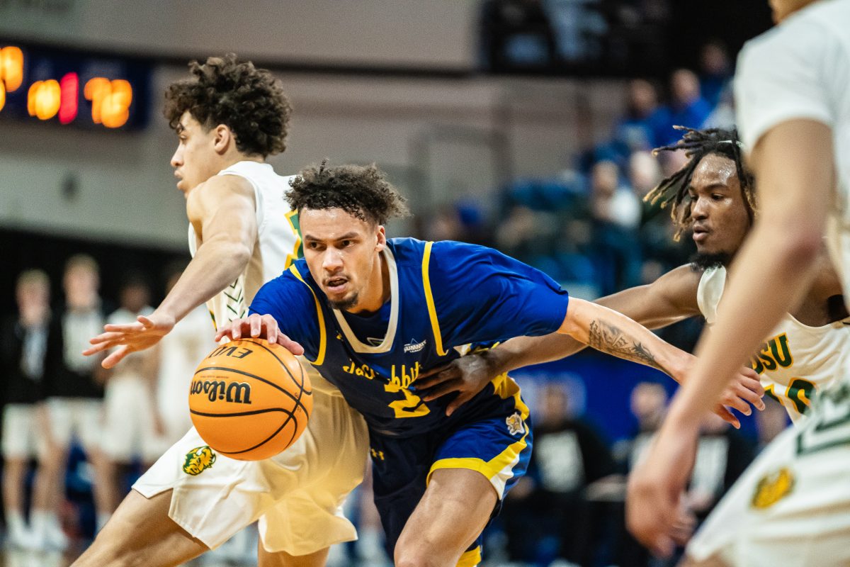 SDSU%E2%80%99s+Zeke+Mayo+weaves+through+Bison+defenders+during+game+against+NDSU+in+Frost+Arena+Thursday%2C+Feb.+1%2C+2024.+Mayo+finished+with+35+points+in+SDSU%E2%80%99s+loss+to+North+Dakota+State.