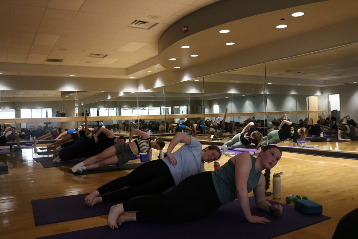 Students participating in a fitness class at the Miller Wellness Center. The wellness center has offered more classes this semester due to growing popularity. 