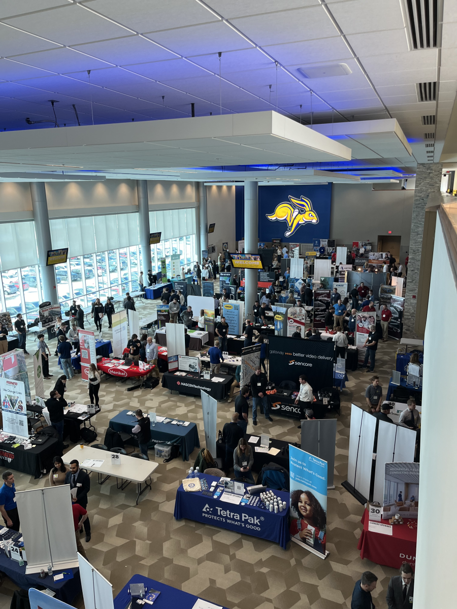 An overhead view of the Ness School Management, Economics and Communication Career Fair in Club 71 at Dana J. Dykhouse Stadium in Brookings.