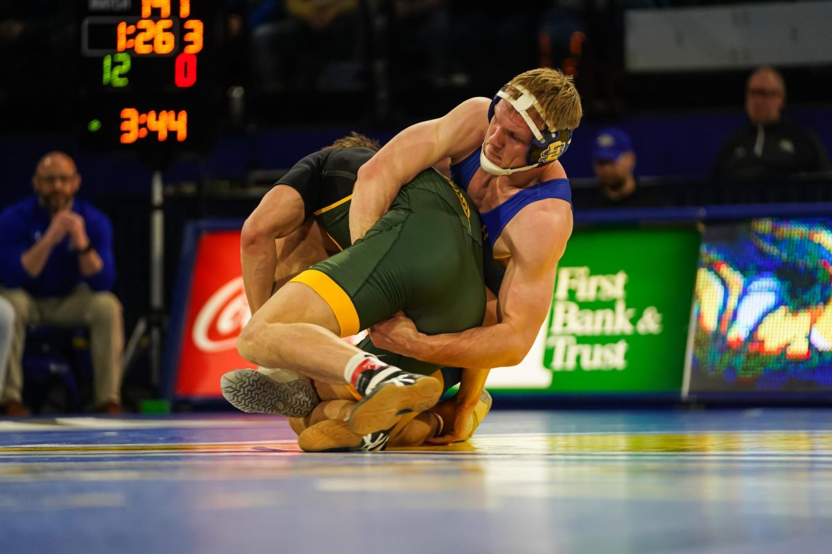 South Dakota State’s Tanner Sloan defends a shot from his North Dakota State opponent in the team’s dual win against the Bison Sunday Feb. 25, 2024. Sloan finished his career in Frost with an undefeated record going 25-0 in duals in Frost Arena.