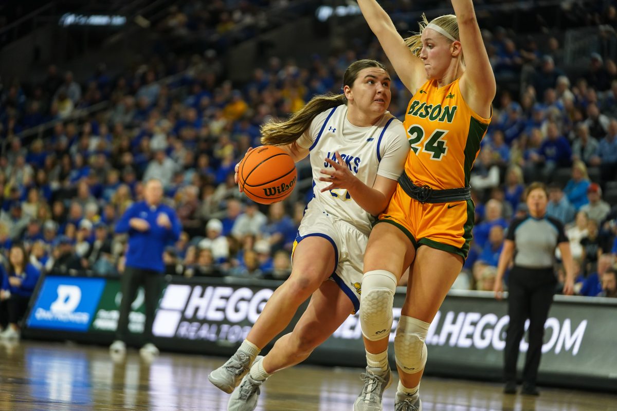 SDSU’s Paige Meyer, Summit League Championships MVP, charges past North Dakota State’s Abby Schulte during the Summit League title game Tuesday, March 12, 2024 at the Denny Sanford PREMIER Center.