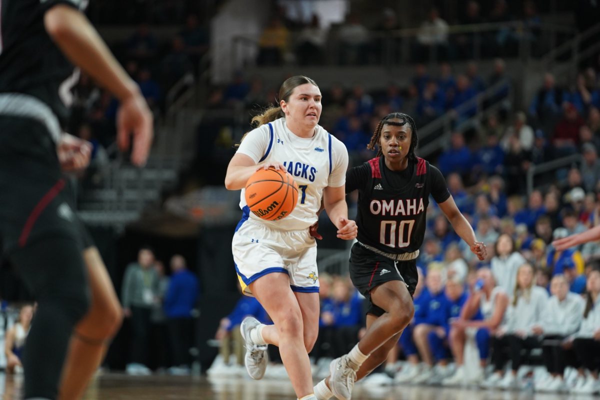 Paige Meyer drives passed Omaha defender while making her way to the rim.