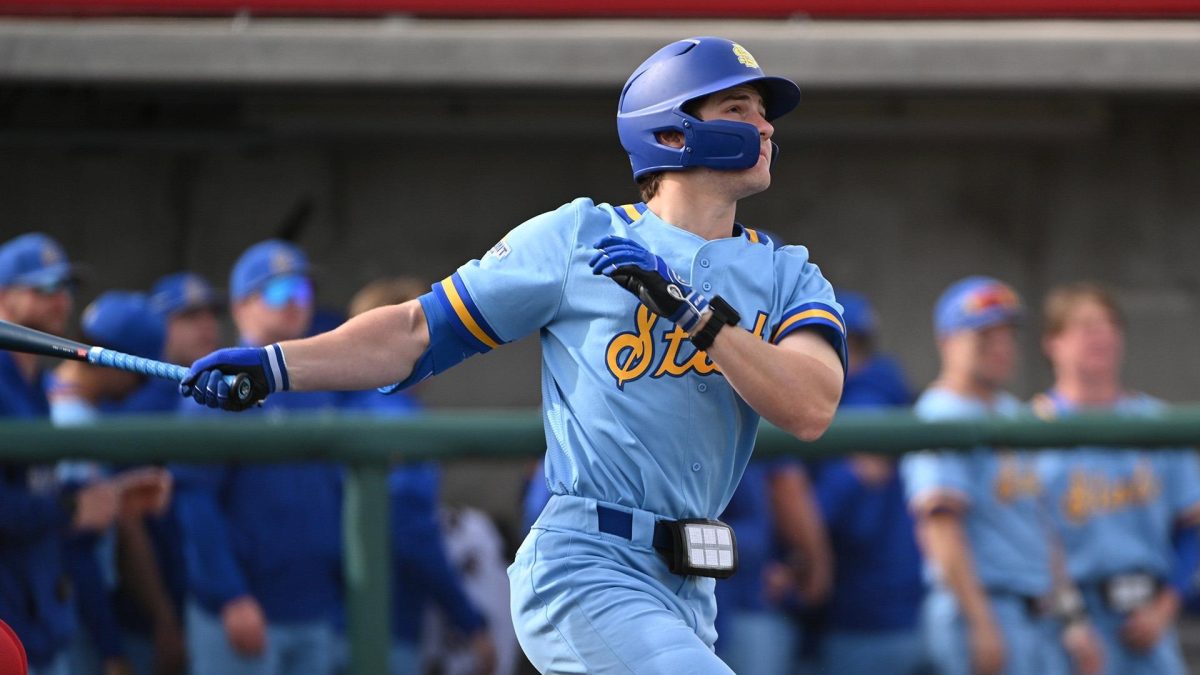 Cael Frost watches the ball fly after swinging during his at bat in the Jackrabbits game against NDSU in Fargo, N.D. Friday, April 5,2024. Frost started the scoring with a home run in the top of the first.