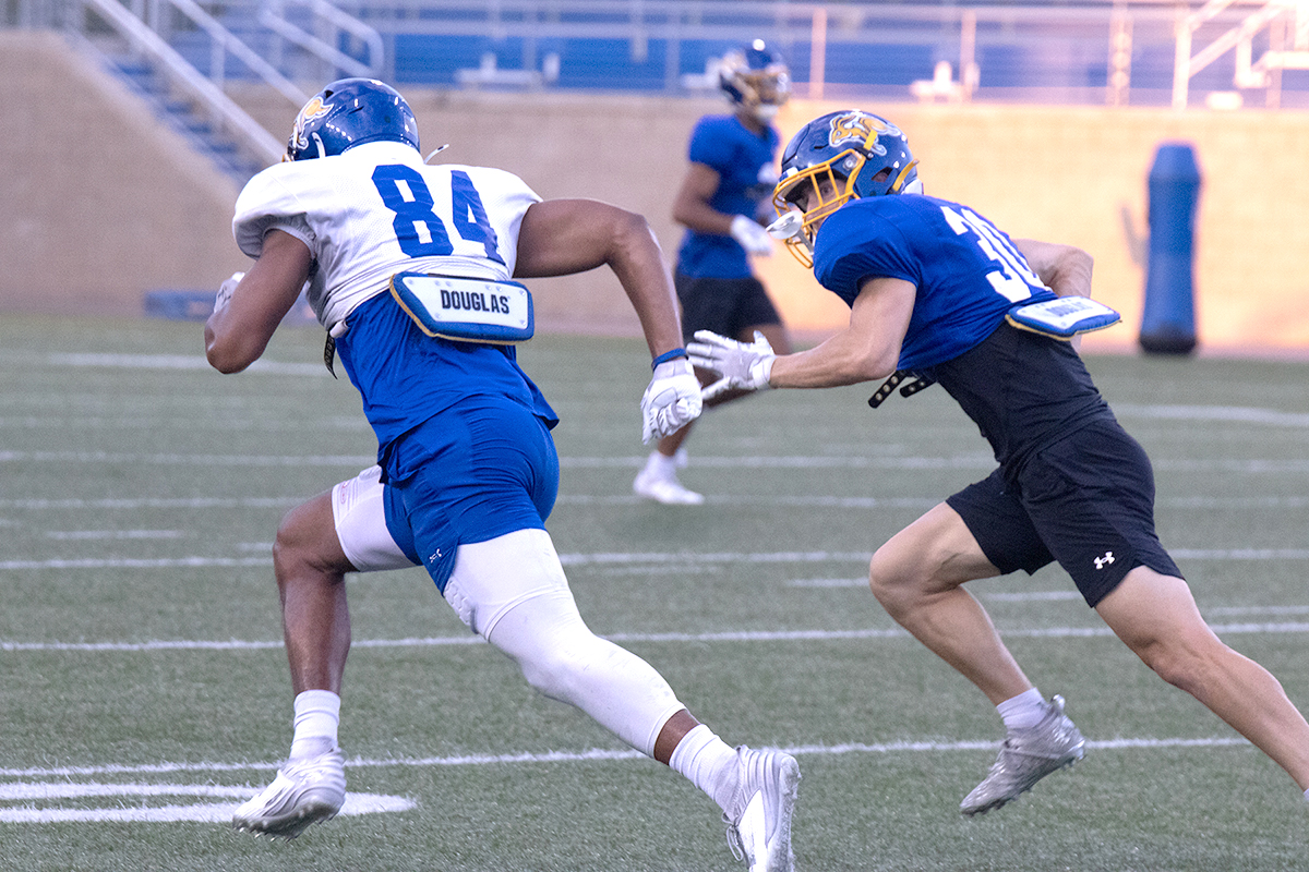 Cornerback Cody Cotton, a junior from Wisconsin covers redshirt-freshman Joe Randle in practice last week. Randle is a 6’3 wide reciever and Cotton stands at 6’0.