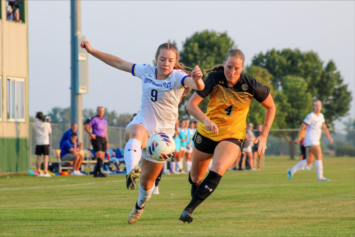 South Dakota State's Katelyn Beulke tries to kick  the ball past a defender during a college women's soccer game against Wayne State on Thursday, Sept. 12, 2024, at Fishback Soccer Park in Brookings.