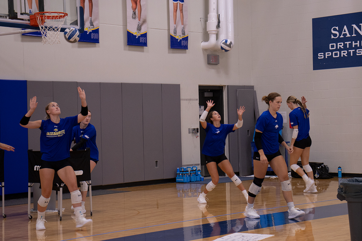 L-R: Rylee Martin, Joslyn Richardson, Meghan Roggenkamp, Rachel Wieber, Finley Westover

Volleyball team practicing serving 