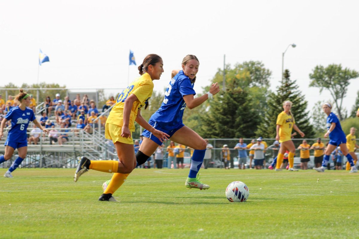 South Dakota State's Zoe Wittkop runs with Drake's Layla Kelbel during a soccer game on Sunday, Sept. 8 at Fishback Soccer Park in Brookings. Wittkop was the only Jackrabbit to find the back of the net on Sunday, scoring her first career goal. 