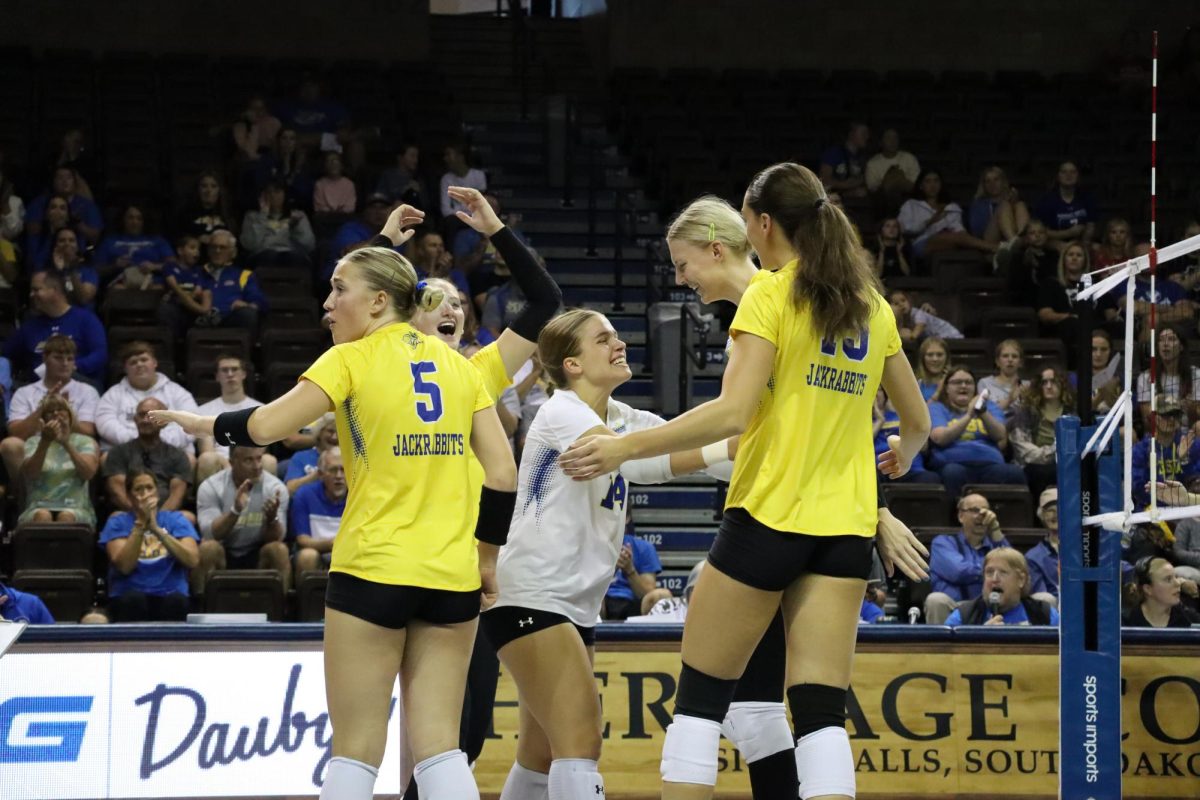 From left: Rylee Martin (5), Katie Van Egdom, Alia Schlimgen (14), Sydnie Schetnan and Alyssa Groves (15), celebrate after a point during a match against Belmont on Saturday, Sept. 21, 2024, at the Sanford Pentagon in Sioux Falls. 